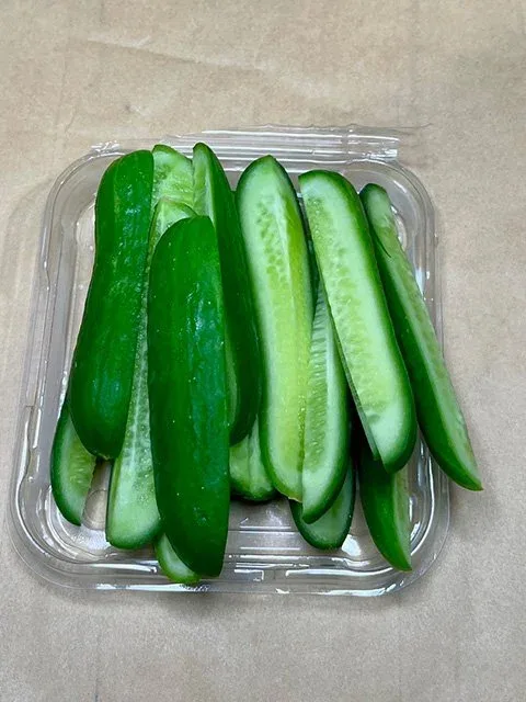 Baby cucumbers sliced in half lengthways